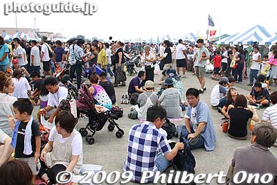 A giant food court on the tarmac. Good idea to bring something to sit on. Lucky that it wasn't a bright sunny day. Otherwise, the tarmac would be like a frying pan.
Keywords: tokyo fussa yokota united states usa air base force military japanese-american japan america friendship festival