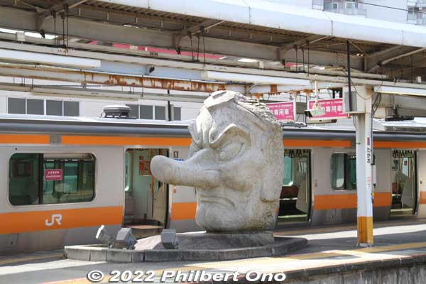 Takao Baigo is near JR Takao Station and Keio Line Takaosanguchi Station. JR Takao Station has this giant tengu mask on the platform. Mt. Takao, which has long been a sacred mountain, supposed to be where one of the major tengu dwells. 
So the tengu is a local symbol.
Keywords: tokyo hachioji takao baigo ume plum blossoms flowers
