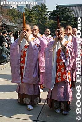 Two men playing a gagaku instrument called "sho." 笙
Gagaku music is commonly associated with the Shinto religion. However, this Buddhist temple has been playing gagaku since long ago.
Keywords: minato-ku tokyo zojoji jodo-shu Buddhist temple setsubun priest gagaku