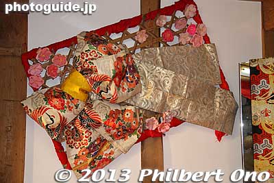 Kimono decoration on the left wall inside the kura.
Keywords: tokyo mizuho-machi hina matsuri doll festival koshinkan