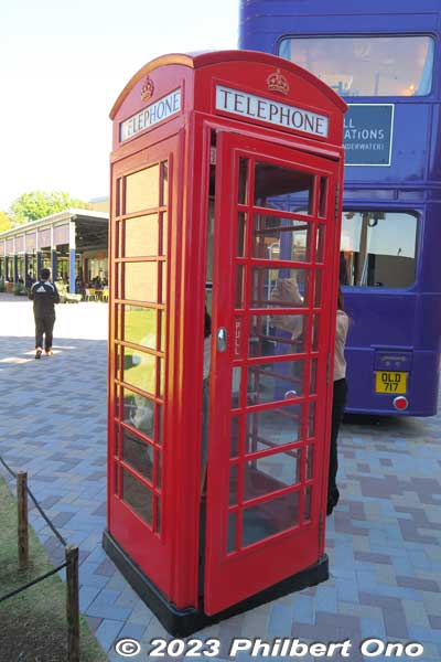 Next to the Knight Bus, red telephone box.

