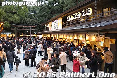 Buying amulets. 
Keywords: tokyo shibuya-ku meiji shrine shinto