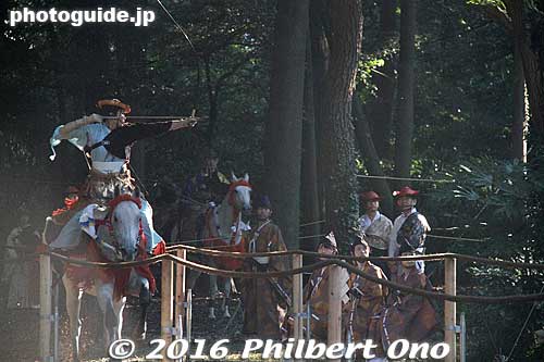The archer shoots at the first target. The second target is in the middle of the track and the third is toward the end of the track.
Keywords: tokyo shibuya-ku meiji shrine shinto yabusame horseback archery