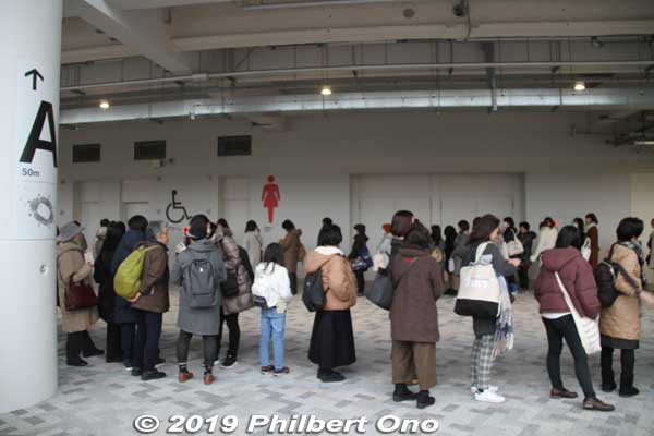 Long line for the women's restroom on the ground floor. 
There are men's and women's restrooms on each floor. If the line is too long, just look for another one.

Keywords: tokyo shinjuku olympic national stadium