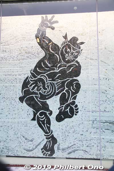 Mosaic wall mural of Nomi no Sukune, a legendary sumo wrestler posing as a victor. By pioneering artist Hasegawa Roka (長谷川路可 1897–1967). 
Keywords: tokyo shinjuku olympic national stadium