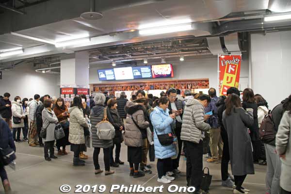 A number of concession stands along the concourse, but long lines. 
I brought my own food and drinks, so I didn't bother to stand in line. No vending machines in the stadium. The cheapest drinks were ¥300.
Keywords: tokyo shinjuku olympic national stadium