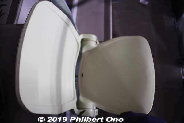 My seat, made of hard plastic. 
Keywords: tokyo shinjuku olympic national stadium