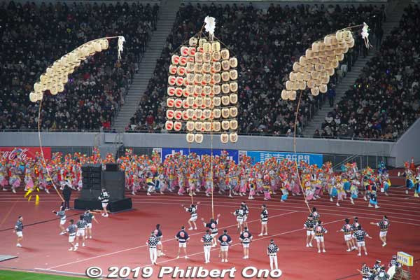 Aomori Nebuta Matsuri parading past Akita Kanto lanterns.
