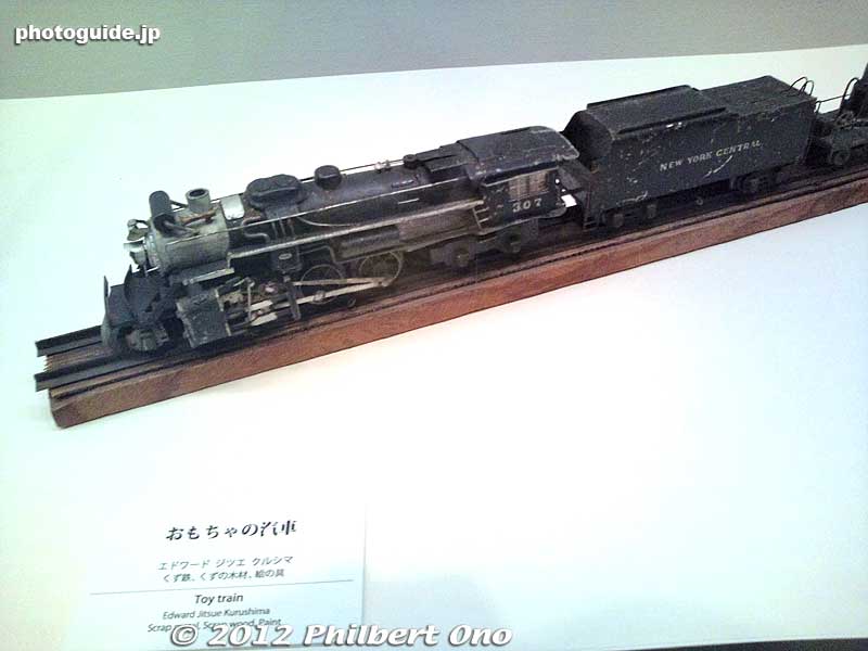 Toy train made of scrap metal. In the front is a caster wheel, perhaps from a chair.
Keywords: tokyo taito keno university art museum japanese american gaman