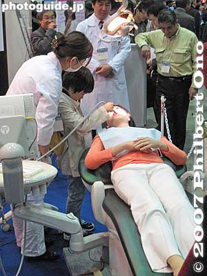 The woman in the dentist's chair is actually a robot. Life-like female robot for dental students. This robot has silicon skin. However, it cannot stand up by itself nor walk.
Keywords: tokyo robotics show fair trade humanoid robots