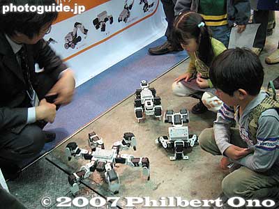 Toy robots also fascinate kids.
Keywords: tokyo robotics show fair trade humanoid robots