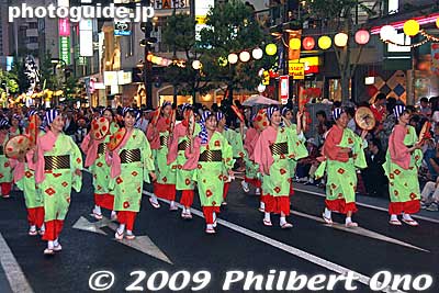 Many dance groups were sponsored by large companies, and the company name or logo was prominently displayed on the clothing. It really is a long advertising parade.
Keywords: yamagata hanagasa matsuri festival tohoku flower hat dancers woman girls women kimono 
