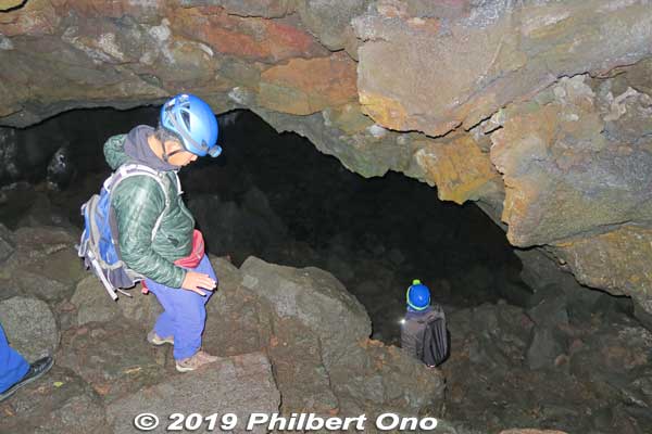 Our guide gave us overalls, a helmet with headlight, and rubber gloves for this excursion. The cave entrance is narrow, steep, and dark. 
But once inside, you can walk upright most of the way. This lava tube is about 230 meters long, 5 to 10 meters wide, 5 meters high (except for the small entrance). Advance permission is required from the local Board of Education to enter.
Keywords: yamanashi fujikawaguchiko aokigahara forest